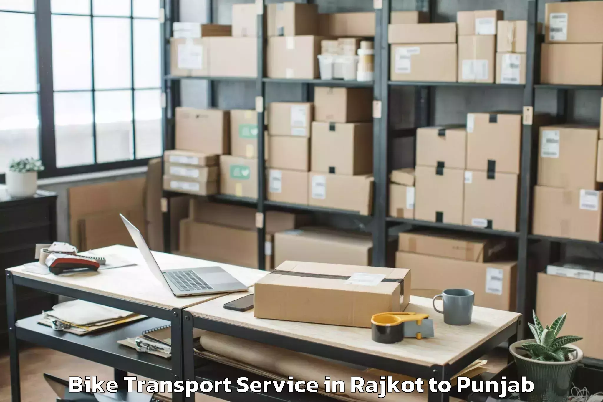 Leading Rajkot to Raja Sansi Airport Atq Bike Transport Provider